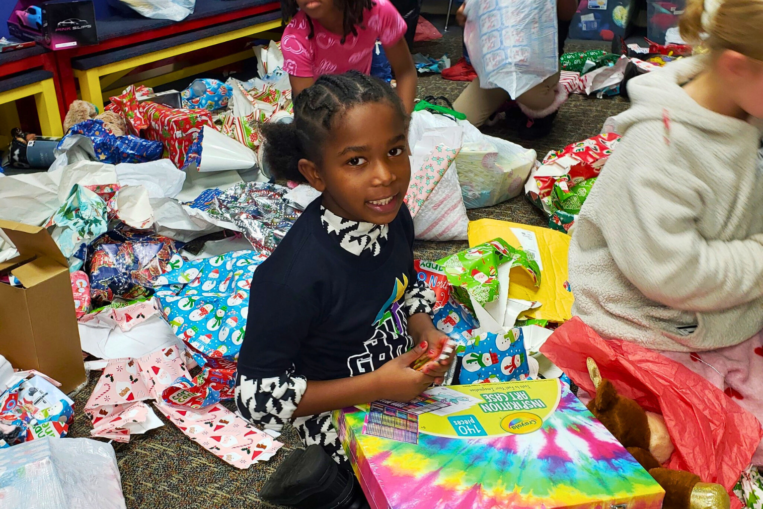 Rock House Kids Christmas Outreach Present Unwrapping